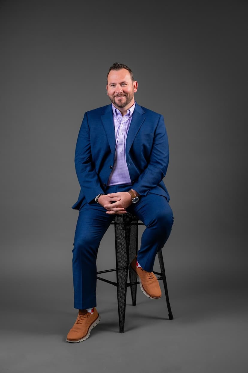 Eli Bowman speaking at a large motivational event